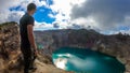 Kelimutu - A man admiring turquoise coloured volcanic lakes