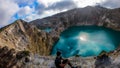 Kelimutu - A man admiring turquoise coloured volcanic lakes