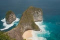 Kelingking Beach Horizon: Foamy Waters Embrace the Sandy Shoreline