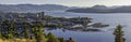 Kelowna British Columbia skyline and Okanagan Lake with the R W Bennett Bridge from Knox Mountain at sunset Royalty Free Stock Photo