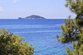 Kelyfos (Turtle) Island on horizon of the Aegean Sea. Royalty Free Stock Photo