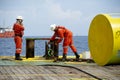 Marine crew working on deck during anchor handling operation