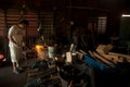 Kemaman, Terengganu, Malaysia - April 04.2015 A BLACKSMITH MAKING KNIFE WITH TRADITIONAL WAY