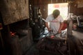 Kemaman, Terengganu, Malaysia - April 04.2015 A BLACKSMITH MAKING KNIFE WITH TRADITIONAL WAY