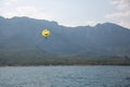 Kemer resort area. Seascape with Taurus mountains and parasailing