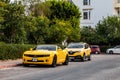 Kemer, Turkey - 08,31, 2021: Bright yellow Chevrolet Camaro with black stripes standing at car parking near luxury hotel under Royalty Free Stock Photo