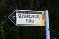 Kemer, Turkey - February 6, 2022: Waymarking sign on the outskirts of Kemer. Selver Cukuru is a popular rock climbing trail in