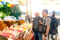 Bazaar merchant invites a tourist to taste ginger tea in Kemer, Turkey