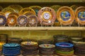 KEMER, TURKEY - OCT 4, 2017: Plates and clocks on shelves souvenirs in the Kemer Old Bazaar store