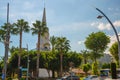 KEMER, TURKEY: White clock tower stands on the Central square of the city of Kemer in Turkey.