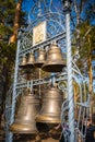 Kemerovo, Russia - April 16, 2022: Bells near Church of Cyril and Methodius in open-air museum Tomsk pisanitsa located