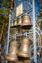 Kemerovo, Russia - April 16, 2022: Bells near Church of Cyril and Methodius in open-air museum Tomsk pisanitsa located