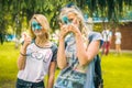 Kemerovo, Russia, June 24, 2018: Two young girls painted colored powder after holi festival of colors