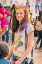 Kemerovo, Russia, June 24, 2018: Young girl painted in colored powder at holi festival of colors