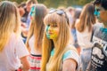 Kemerovo, Russia, June 24, 2018: Young girl painted in colored powder at holi festival of colors