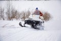 Kemerovo, Russia - 23.02.2019: Rider on the snowmobile in nature of Siberia, Russia