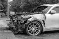 Kemerovo 2019-09-16 Wheel of white abandoned, stolen city car Infiniti FX50S burned out, suddenly started engulfing all