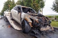 Kemerovo 2019-09-16 White abandoned, stolen city car Infiniti FX50S burned out is evacuated. Concept arson, crime