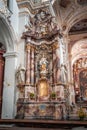Kempten, Germany - Aug 3, 2020: Altar shrine view of St. Lawrence Basilica with masked tourist
