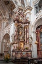 Kempten, Germany - Aug 3, 2020: Altar shrine view of St. Lawrence Basilica with masked tourist