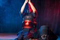 Kendo fighter tying the cloth on his head before wearing helmet