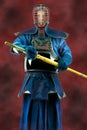 Kendo - Kendoka in full armor and bamboo sword. Studio shot. Royalty Free Stock Photo