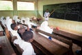 Students with teacher during English lesson, Zanzibar