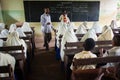 Students with teacher during English lesson, Zanzibar