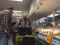 Kenmore, WA USA - circa March 2021: View of an elderly couple shopping in the seafood department at QFC