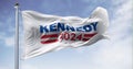 Kennedy 2024 presidential campaign flag waving on a clear day