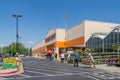 Home Depot line outside the store with masked people practicing social distancing 6 feet apart during Covid-19 Corona Virus