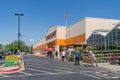 Home Depot line outside the store with masked people practicing social distancing 6 feet apart during Covid-19 Corona Virus