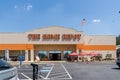 Home Depot line outside the store with masked people practicing social distancing 6 feet apart during Covid-19 Corona Virus