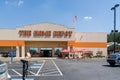 Home Depot line outside the store with masked people practicing social distancing 6 feet apart during Covid-19 Corona Virus