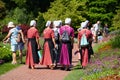 Kenneth Square, Pennsylvania, U.S - July 15, 2022 - A group of Mennonites women walking inside a garden