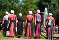 Kenneth Square, Pennsylvania, U.S - July 15, 2022 - A group of Mennonites women walking inside a garden