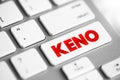Keno is a lottery-like gambling game often played at modern casinos, text concept button on keyboard