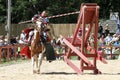 An actor as medieval knight demonstrate skills on horseback at the annual Bristol Renaissance Faire Royalty Free Stock Photo