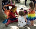 A beautiful girl dressed as a fairy play with children at the annual Bristol Renaissance Faire Royalty Free Stock Photo