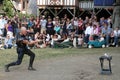 A jongleur performs a precision shot with a whip to a soda can at the annual Bristol Renaissance Faire on September 4, 2010 in Ken