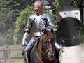 An actor as medieval knight demonstrate skills on horseback at the annual Bristol Renaissance Faire Royalty Free Stock Photo