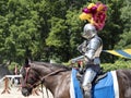 An actor as medieval knight demonstrate skills on horseback at the annual Bristol Renaissance Faire Royalty Free Stock Photo