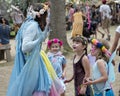 A beautiful girl dressed as a fairy play with children at the annual Bristol Renaissance Faire Royalty Free Stock Photo