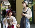 Beautiful girls dressed in medieval costumes with feathers at the annual Bristol Renaissance Faire