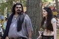 A girl and a man dressed in horrific costumes as a deer and a ram at the annual Bristol Renaissance Faire