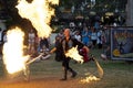 A jongleur performs a dance with burning in flames whips at the annual Bristol Renaissance Faire Royalty Free Stock Photo