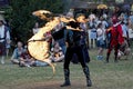 A jongleur performs a dance with burning in flames whips at the annual Bristol Renaissance Faire Royalty Free Stock Photo