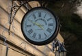 A Kensington London clock in late winter afternoon sun light