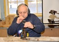 KENTSHIN, POLAND. A master blows out a glass Christmas tree toy. Christmas tree toy factory