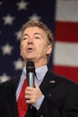 Kentucky Senator Rand Paul speaking in front of flag.